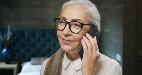 Elderly Woman Talking on Smartphone