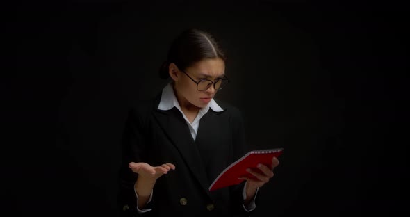 Business Woman is Dissatisfied with the Document She Read Throws Away Notepad