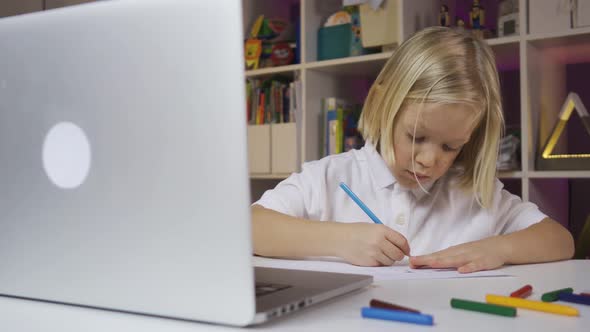 Distance Learning Online Education, A Pre School Boy Learning at Home in a Kids Room