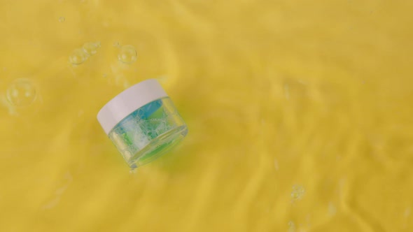 Rippling Water Surrounds Innovative Foaming Blue Moisturizing Gel in Glass Jar