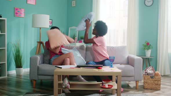Women Roommates Are Fighting By Pillows alt