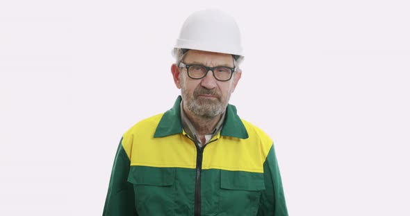 Portrait of Old Man in Suit and Helmet Isolated Over White Background, Human Emotions and Facial alt