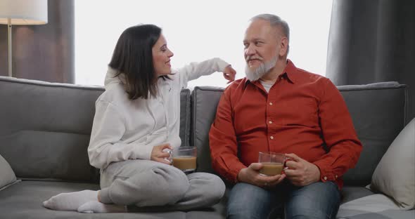 Happy Senior Elder Father Grandfather and Young Adult Granddaughter Grown Daughter Talking Bonding alt