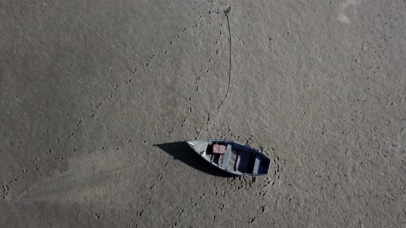 Top View of Boat at Shore of Dried Up Sea Global Warming and Drought Concept alt