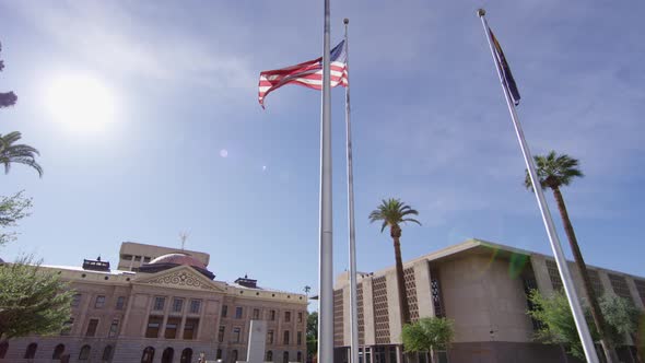 Flags in front of the Arizona Capitol building alt