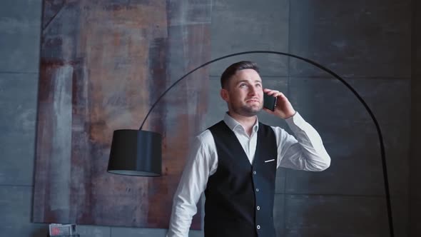 Successful Happy Businessman Luxurious Black Suit is Dialing Calling Through His Modern Smartphone alt