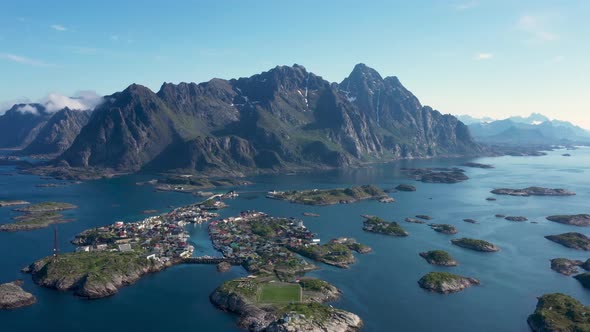 Fly over the sea,view on the Henningsvaer fishing village Lofoten Islands,Norway