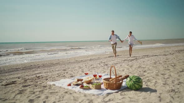 Slow Motion Happy Couple on Beach Picnic alt
