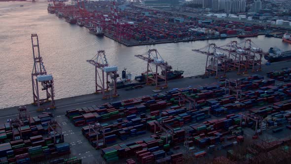Timelapse Containers on Busan Harbour Port Site at Sunrise alt
