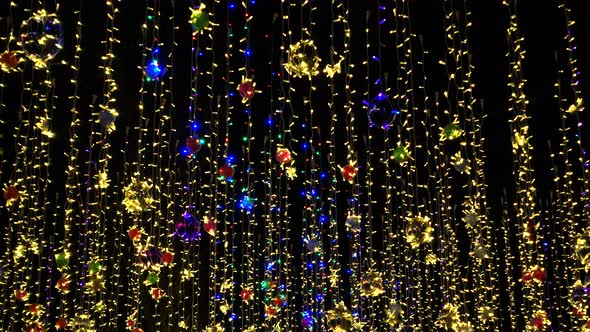 Beautiful Colorful Holidays Decorations, Garlands Sway on Wind in Night Sky. alt