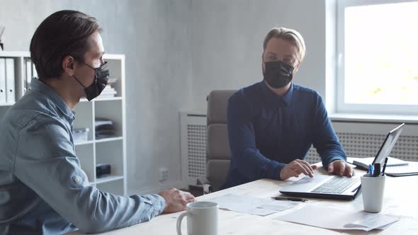 Two business persons are work together in modern office. Team of businessmen. alt