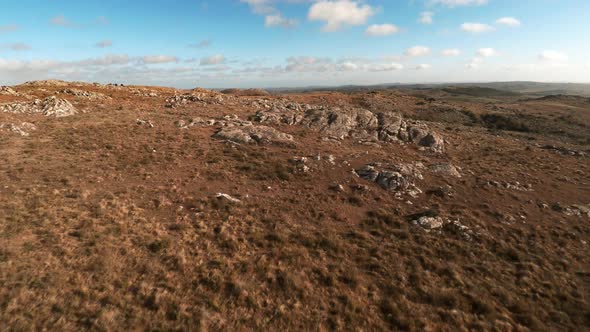 Aerial view of road through rocky landscape alt