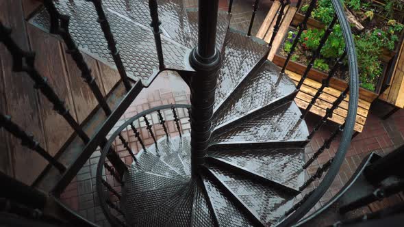 Screw Metal Stairs While Rain is Going