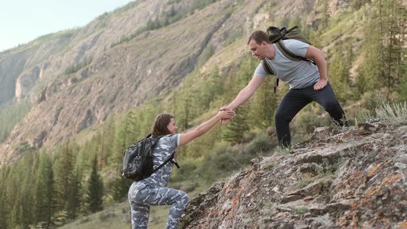 Helping Hand Between Two Climbers alt