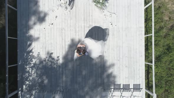 Top down aerial view of wedding couple spinning in a wedding pier 32 alt