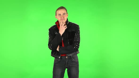 Guy Listens Attentively and Nods His Head Pointing Finger at Viewer. Green Screen alt