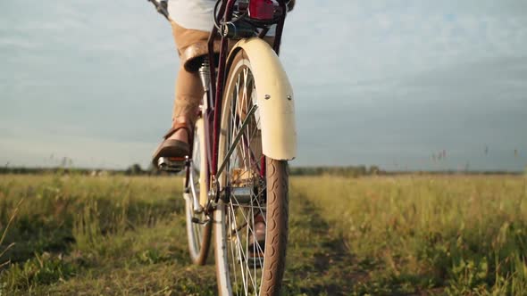 A Man Rides a Retro Bike