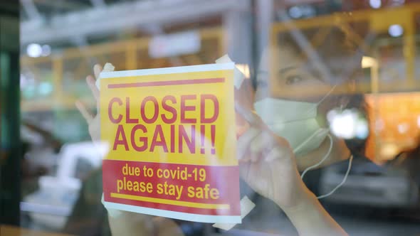 asian female working hand use laptop at counter in cafe coffeeshop restaurant alt