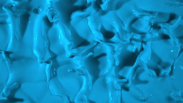 Super Slow Motion Shot of Splashing Blue Paint at 1000Fps alt