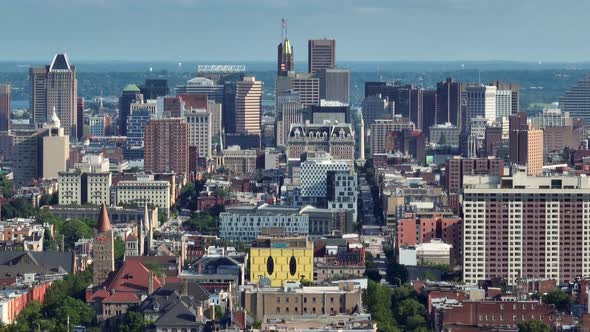 Downtown Baltimore Maryland city skyline. Aerial truck shot with long zoom. alt