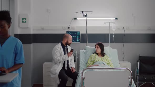 Physician Medic Consulting Sick Patient During Medical Appointment alt