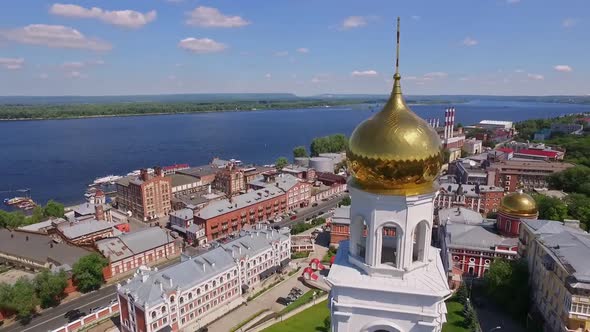 Drone is Flying Around Golden Shiny Dome of Orthodox Bell Tower in City at Summer Day