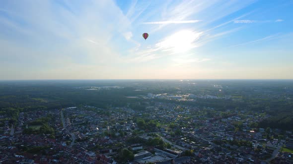 Flying towards a hot air balloon in summer