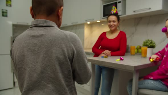Multiethnic Family Celebrating Birthday of Mother at Home alt