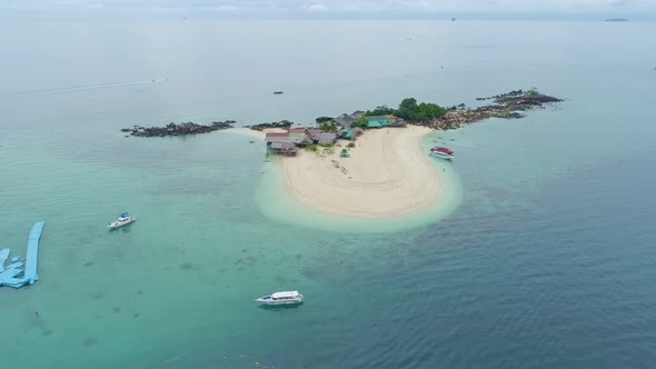 Aerial view drone video of Amazing small island beautiful tropical sandy beach landscape view alt
