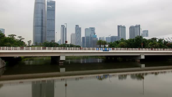 Shenzhen Urban Cityscape China Timelapse at Night with Reflection in Water Pan Up alt