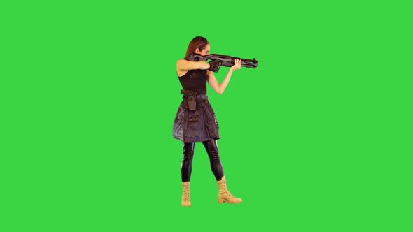Girl with a Gun Searches for Aim and Makes a Single Shot on a Green Screen Chroma Key alt