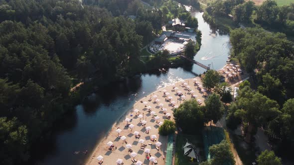 Aerial Top View of River Sand Beach with Lounges and Umbrellas alt