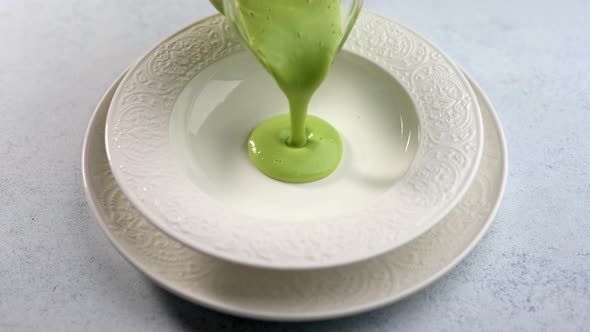 From the Jug Poured Homemade Soup Puree of Green Peas and Coconut Milk