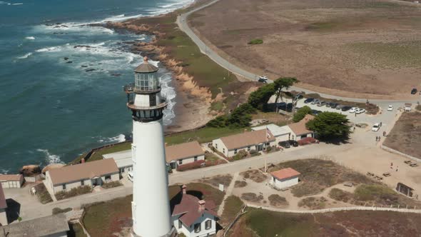 Aerial rotating around Pigeon Point Lighthouse with the blue Pacific Coast in the background ear Hal alt