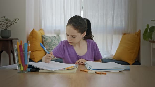 Frustrated young girl trying and failing to prepare homework for school alt