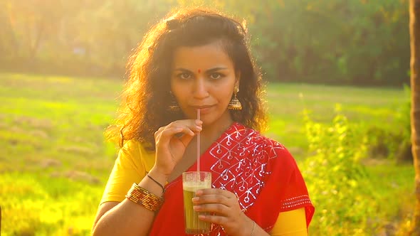 Beauty Indian Portrait Woman Drinking Sweet Fresh Juice Rural Plant Spices and Rice Plantation