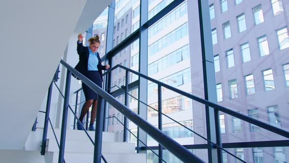 Girl Goes Down Stairs in Good Mood Dancing alt