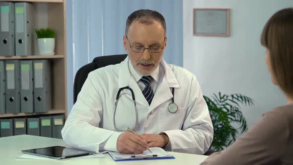 Male Physician Discharging Recovered Female Patient From Hospital Health Care alt