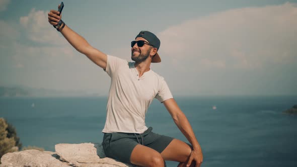 Selfie On Mobile Phone In Beautiful Place In Turkey Trip.Man Taking Self Photo And Answer To Video. alt