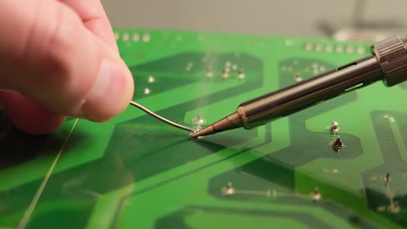 Work With A Soldering Iron. Slow Motion alt