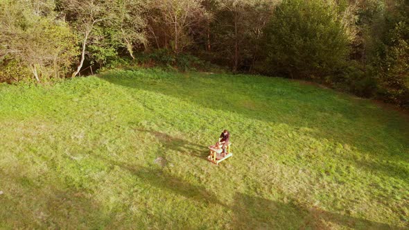 Aerial Drone Fly Over Man Potter Work with Clay Ware alt