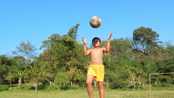 Rural Boy Practice Soccer In Field alt