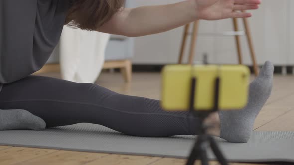 Young Woman Doing her Daily Stretch Routine alt