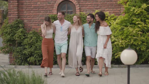 Group of happy young people having fun outdoors