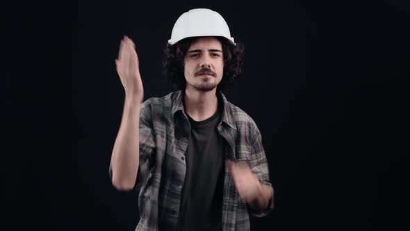 Happy Hipster with Curly Hair Looks Virtual Kiss with Blown Hands Arrogant and Social alt