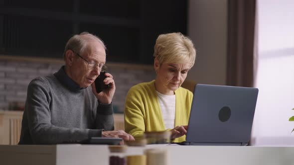 Old Man and Woman are Shopping Online Doing Order in Internet Shop Calling to Callcenter for alt