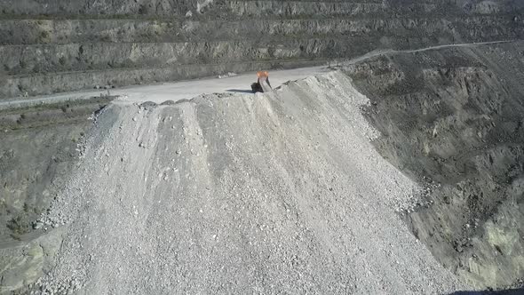 Aerial View Tipper Truck Pours Ground on Asbestos Pit Hill alt