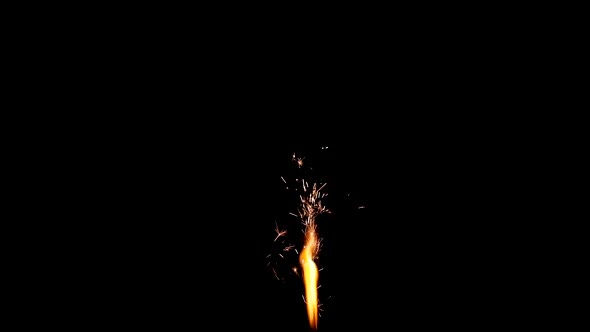 Fountain cake firework or sparkler candle fire burning over black background alt