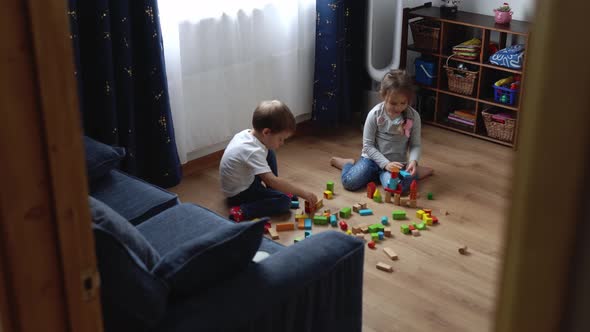 Two Happy Preschool Siblings Children Boy Girl In Playing Room