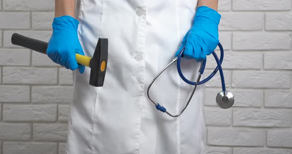 Doctor work with hammer. alt